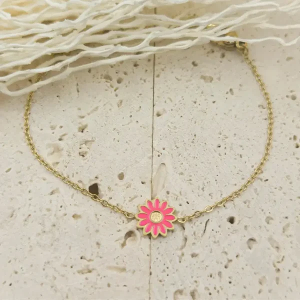Bracelet enfant marguerite en acier doré avec fleur colorée rose fushia ajustable pour petite fille 4 à 9 ans