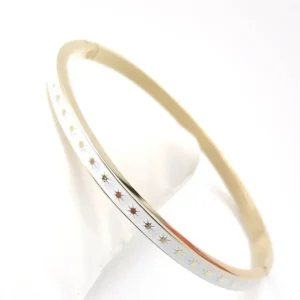 Bracelet jonc ovale rigide acier doré émaillé blanc avec motifs étoiles