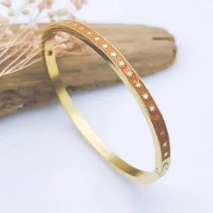 Bracelet jonc rigide acier doré émaillé blanc avec motifs étoiles