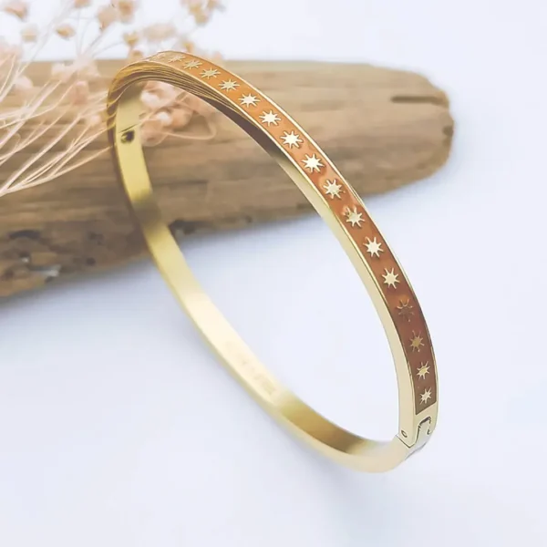 Bracelet jonc rigide acier doré émaillé blanc avec motifs étoiles