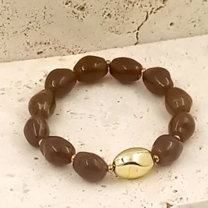 Bracelets en perles en résine ovales marron avec une perle centrale dorée et acier