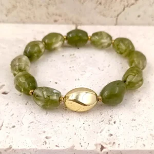 Bracelets en perles en résine ovales vertes avec une perle centrale dorée et acier