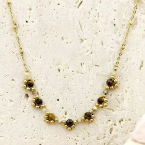 Collier en acier doré orné de perles marrons et dorées, bijou fin et élégant pour femme