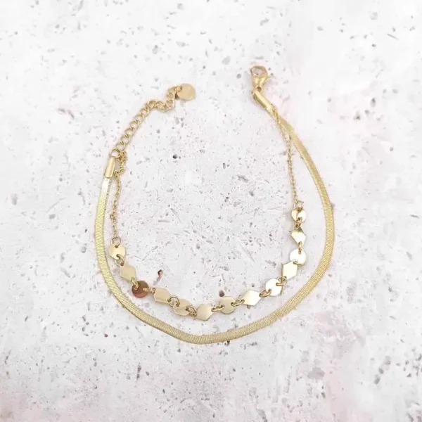 Bracelet double chaîne dorée pour femme avec maillons en forme de losange