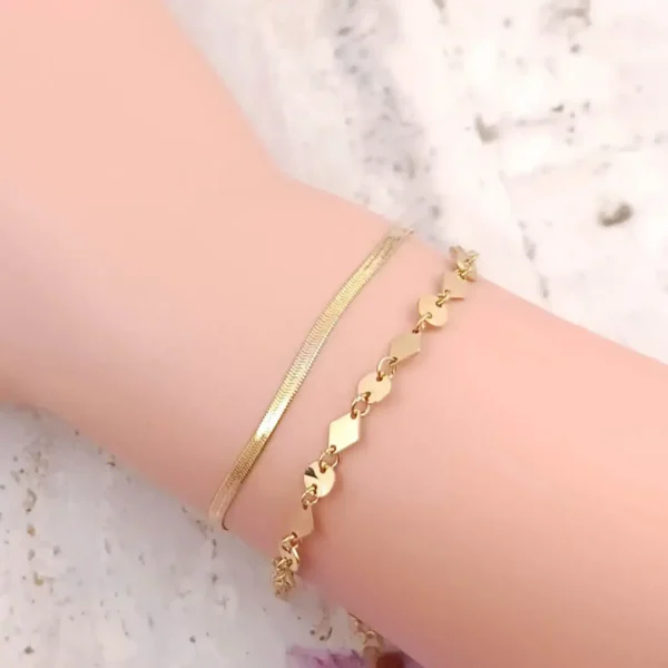 Bracelet double chaîne acier dorée pour femme avec maillons en forme de losange