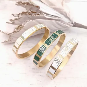 Bracelets joncs rigides en acier doré avec motifs géométriques soleil gravés dorés