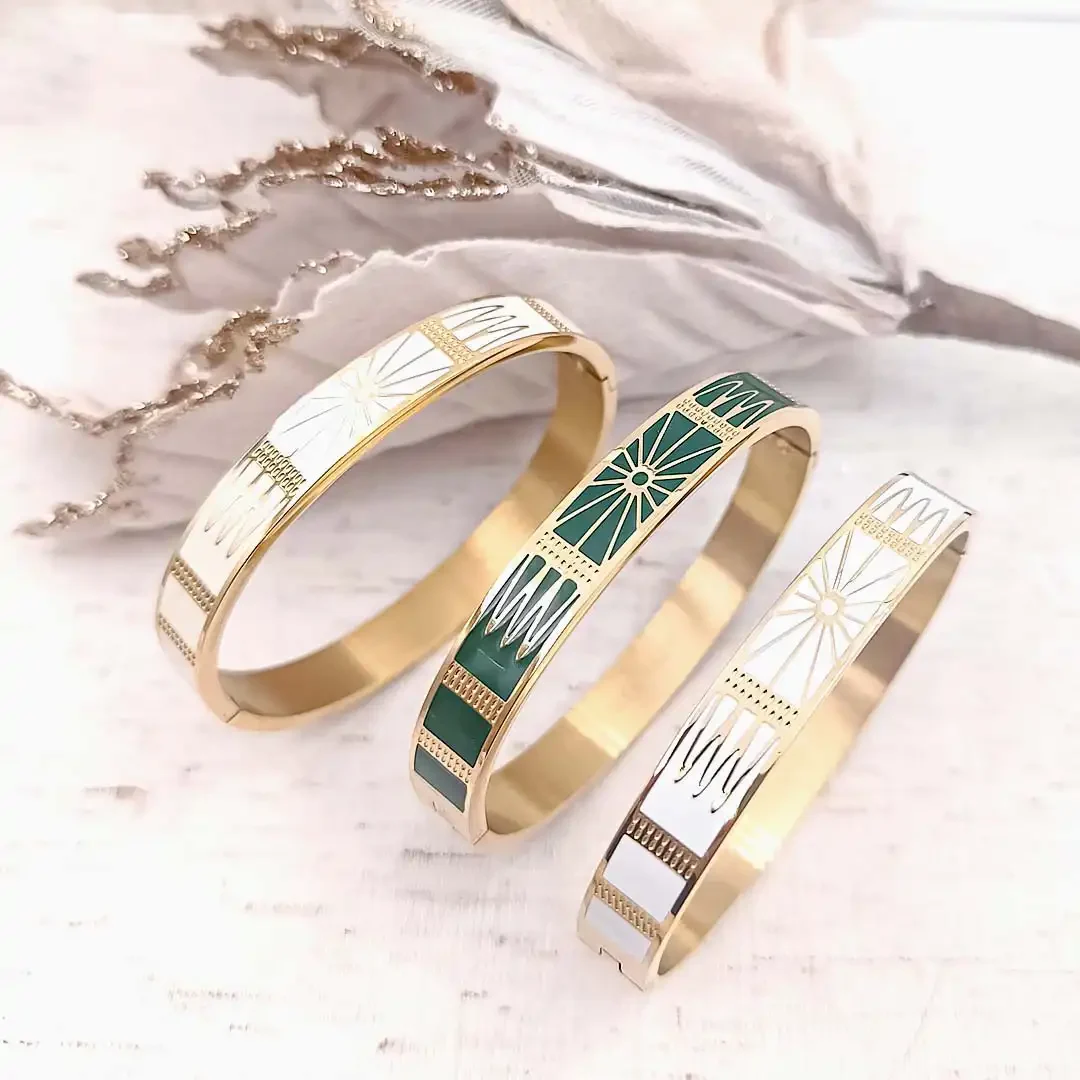 Bracelets joncs rigides en acier doré avec motifs géométriques soleil gravés dorés