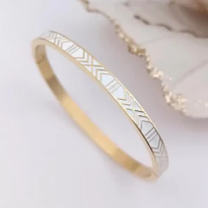 Bracelets joncs rigides en acier doré avec motifs géométriques triangles gravés dorés