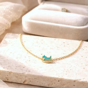 Bracelet petite fille en acier inoxydable doré motif cheval bascule coloré