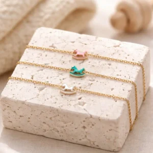 Bijou enfant acier inoxydable doré avec pendentif cheval à bascule émaillé