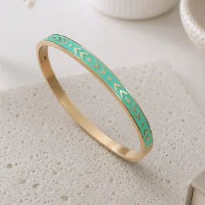 Bracelet jonc acier émaillé vert d'eau en acier inoxydable doré avec motifs géométriques