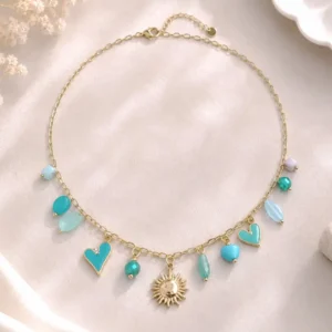 Collier soleil en acier inoxydable doré avec cœurs turquoise émaillés et perles bleues