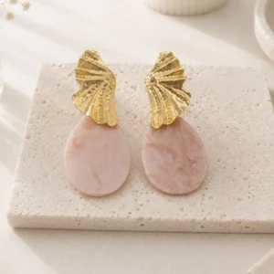 Boucles d'oreilles pendantes nude dorées