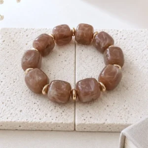 Bracelet élastique en résine marron et acier doré