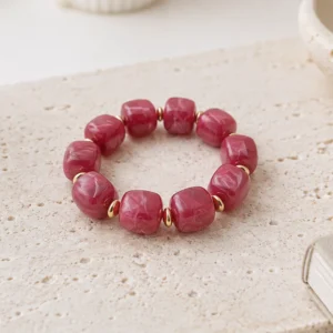 Bracelet élastique en résine rose fuchsia et acier doré