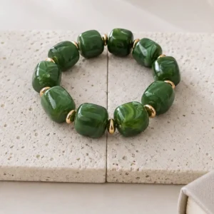 Bracelet élastique en résine vert et acier doré