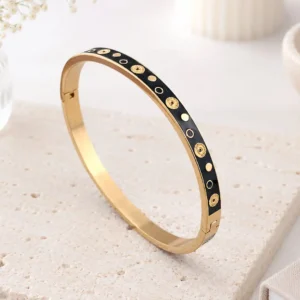 Bracelet jonc acier émaillé noir avec motifs dorés