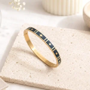 Bracelet jonc acier émaillé noir femme en acier inoxydable doré avec motifs étoiles