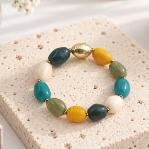 Bracelet élastique en résine multicolore et acier doré