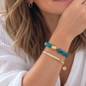 Bracelet élastique en résine bleu canard et acier doré avec jonc